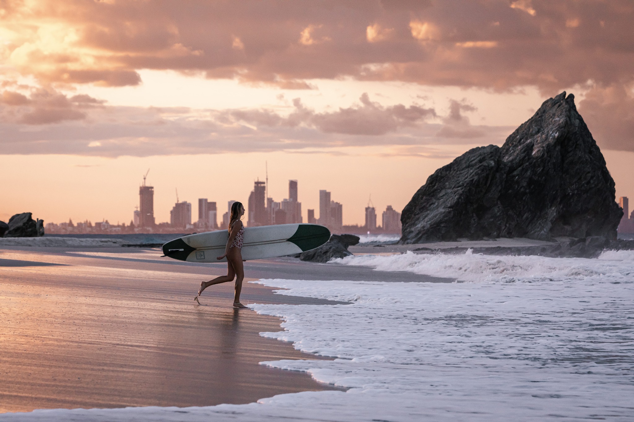 Elephant Rock Currumbin surfer at sunset